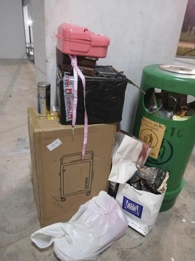 Litter bin and boxes of unwanted items
