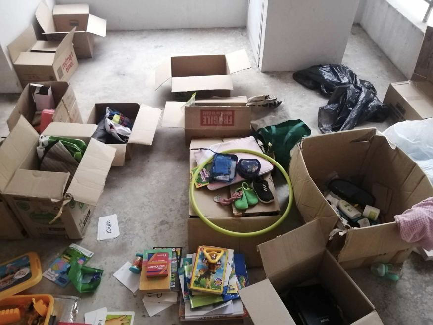 Display of boxes containing various unwanted items 